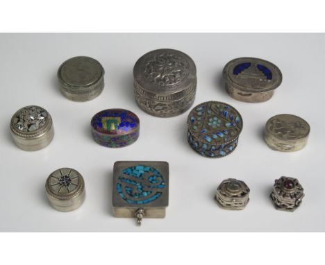 A mixed collection of silver pill and trinket boxes, some with enamel decoration, various sizes,