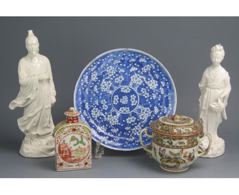 A group of Chinese export porcelain wares including two Blanc de chine figures, 30cm and 27cm high, blue and white plate, flo