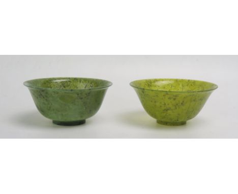 A pair of moss green jade style bowls, 10cm diameter.