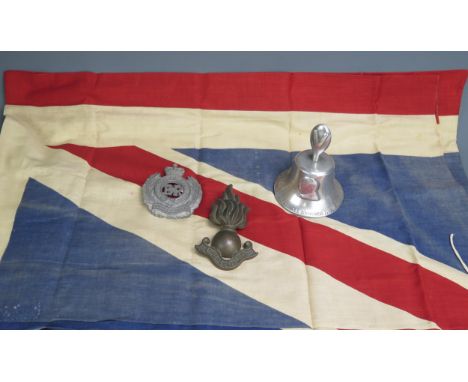 A World War II period bell, cast from metal from German aircraft shot down over Britain, with low relief busts of the allied 