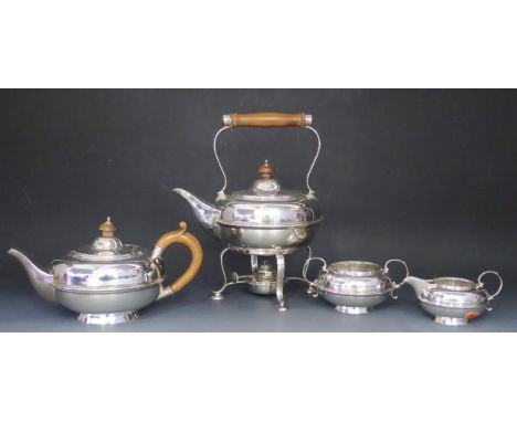 A George V silver four piece tea service, maker William Neale &amp; Son Ltd, Birmingham, 1923/24/25 of squat circular form wi