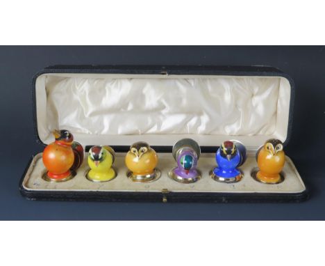 A set of six novelty George V silver gilt and enamel name place holders, maker George Betjemann &amp; Sons, London, 1921, in 