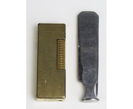 A Dunhill gilt metal Rollagas lighter, together with a Dunhill combination pipe tamper / cleaner.