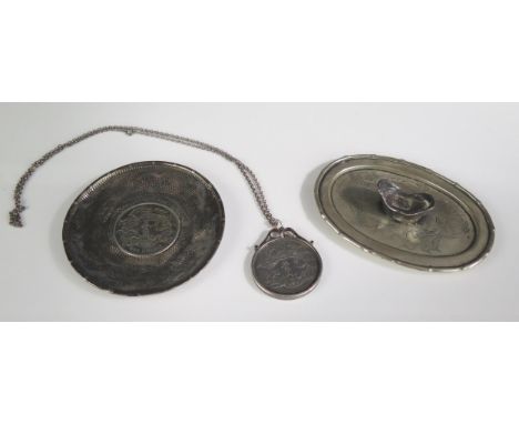 A Chinese silver dish inset with Chinese dollar coin, a dollar coin medallion, and an oval dish, 11cm wide, total weight of s