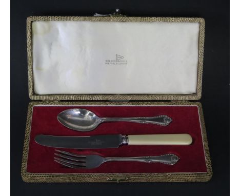 An Elizabeth II silver three-piece christening set, maker Walker &amp; Hall, Sheffield, 1959, with silver spoon and fork havi