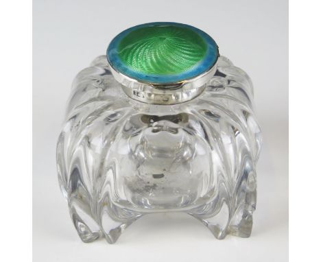 A clear glass, silver and enamel mounted inkwell, of domed square outline, all marks worn.