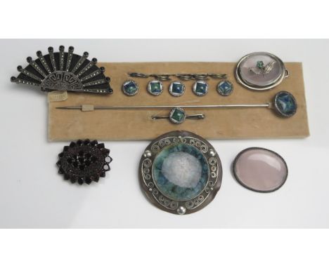 A Ruskin Style Roundel Brooch on a copper and white metal panel, silver and marcasite fan brooch, rose quartz brooch, 'garnet