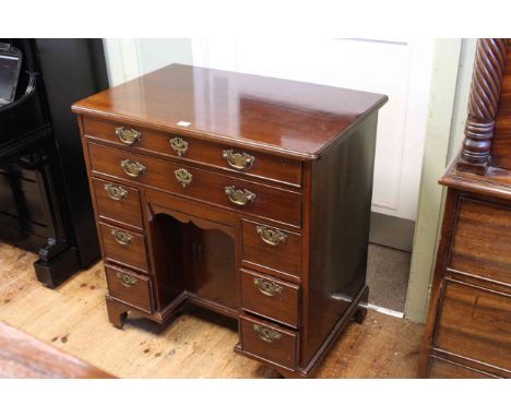 Georgian mahogany kneehole desk having two long drawers, one fitted with easel writng surface above two banks of three drawer