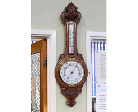 Carved oak aneroid barometer-thermometer