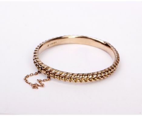 A 9ct gold bangle. 12.5g 