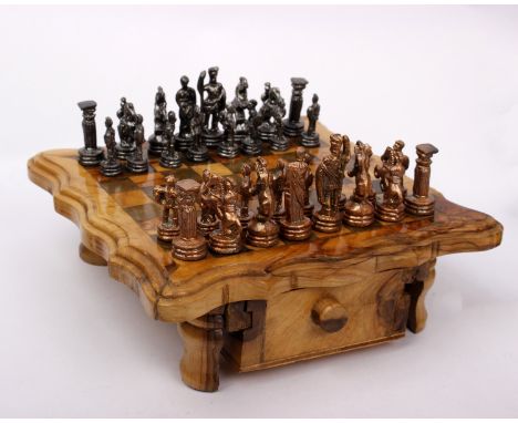 A small chess set  with wooden board and storage drawers. 21cm x 21cm