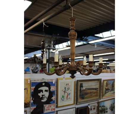 Two Edwardian carved oak six branch chandeliers in the arts and craft style larger one signed A. Dumez,Large light 78(h) x 78
