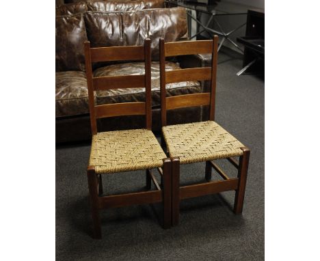 A pair of oak framed ladder back chairs with lattice woven rush seats (Possibly 'Letchworth by Heals)39cm(W) x 40cm(D) x 90cm