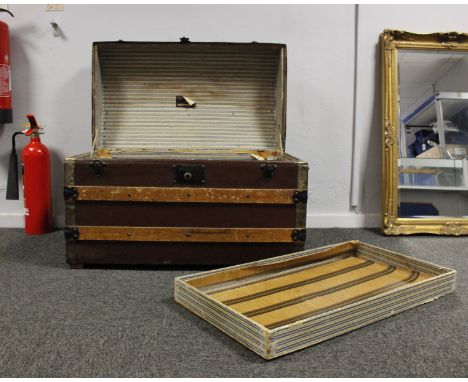 A canvas covered and wooden bound trunk dome top travelling trunk.77cm(W) x 44cm(D) x 50cm(H)