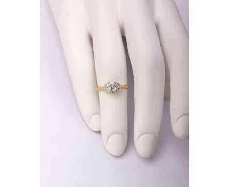 An 18ct gold and platinum single stone diamond ring. Bright cut panel with central illusion set single cut diamond. 3g size K