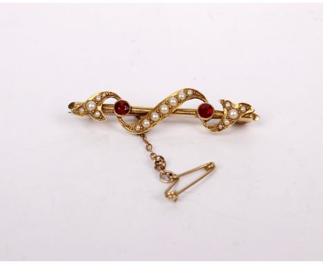 A 15ct gold ruby and split pearl bar brooch. 3.7g. 