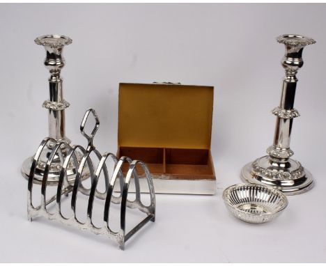 A pair of electroplated candlesticks together with a large plated toast rack and engine turned cigarette box and a small dish
