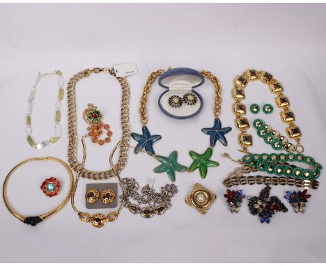 A collection of vintage couture jewellery to include Yves Saint Laurent necklaces and brooches, Joan Rivers earrings, Kenneth