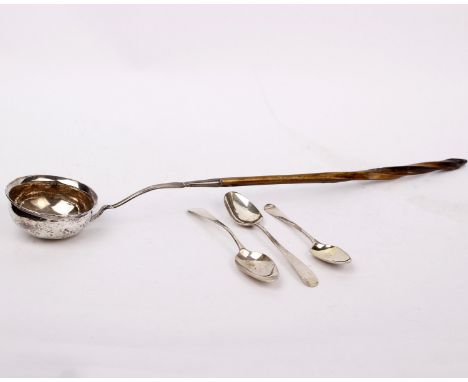 A Georgian white metal coin set toddy ladle with antler handle together with three Georgian silver tea spoons. 