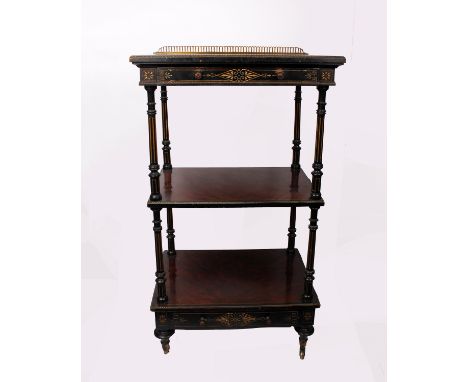 Gillows &amp; Co. An ebonised wood and Amboyna three tier whatnot. Single drawer to top and bottom shelf with pierced brass g