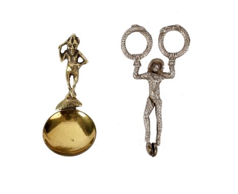 White metal Harlequin sugar tong and a imp tea caddy spoon in brass