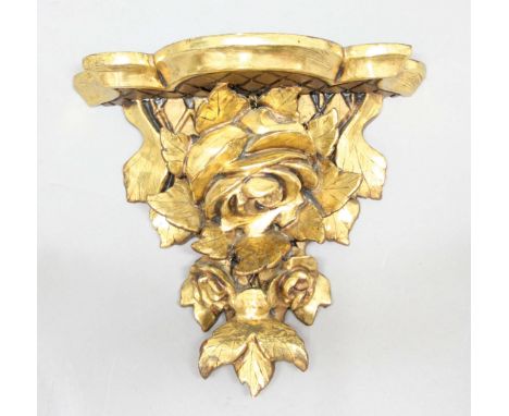 CARVED GILTWOOD WALL BRACKET, possibly Italian, the shaped shelf above a rose head, height 26cm