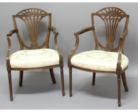 PAIR OF SHERATON STYLE MAHOGANY ELBOW CHAIRS mid 19th century, the arching foliate top rail above a wasted, pierced splat, wh