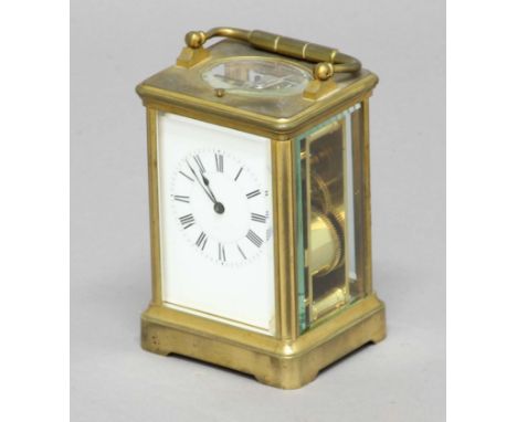 FRENCH GILT BRASS FOUR PANE CARRIAGE CLOCK, late 19th century, the enamelled dial on an eight day striking and repeating move