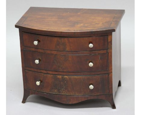 GEORGE III MAHOGANY MINIATURE CHEST OF DRAWERS, bow fronted with three long drawers and turned ivory pulls, height 36cm, widt