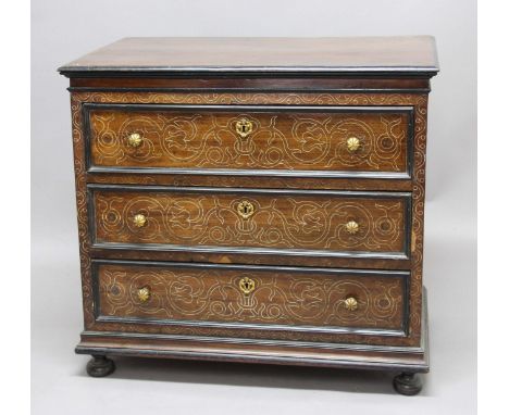 NORTH ITALIAN WALNUT AND BONE INLAID COMMODE, mid 19th century, the three long drawers with ebonised cockbeading, with scroll
