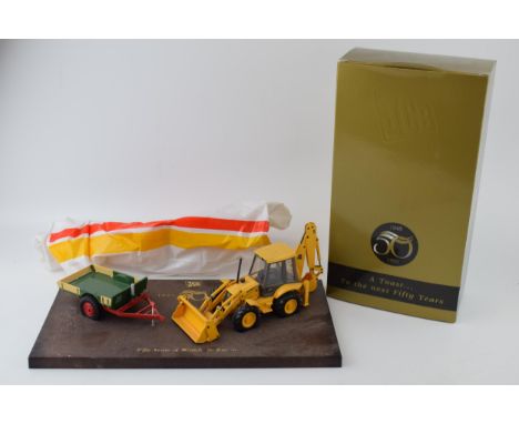 JCB 'Fifty Years of Worldwide Success'  1945-1995 model of a Sitemaster and a trailer, 36cm wide with a pair of champagne flu
