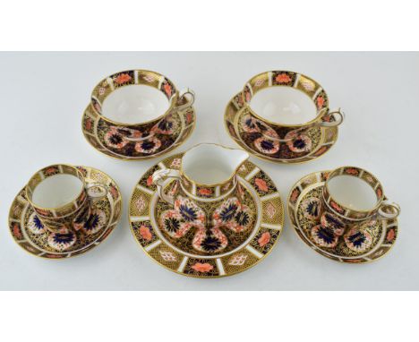 Royal Crown Derby Imari pattern items to include trio, cup and saucer, two coffee cans and saucers and a milk jug. (10)  In g