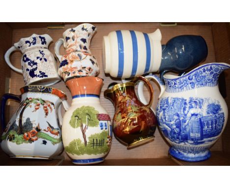 A collection of ceramic water jugs by Wedgwood. Mason's, Crown Devon and other similar manufacturers.  In good original condi