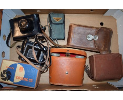 A collection of vintage cameras and binoculars to include a Zorki - 4 35mm camera with lens, an OMO Cosmic 35 in original lea