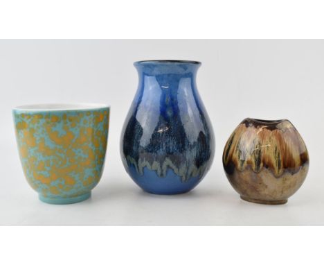Poole Pottery vases to include a bulbous vase in blue glaze, a similar short vase in blue and orange colours with a smaller b