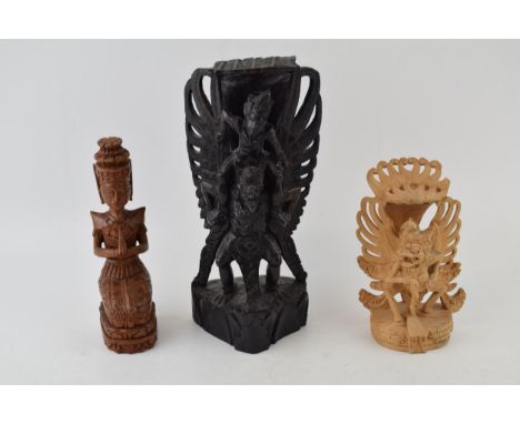 Three carvings of deities from Bali. In different woods. (3) Height 25cm.  