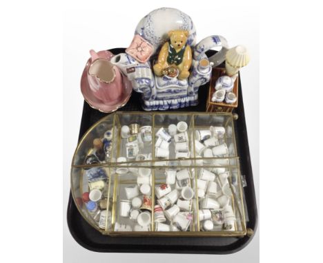 A brass and glass display stand containing assorted ceramic thimbles, together with a Ringtons novelty teapot, Maling lustre 