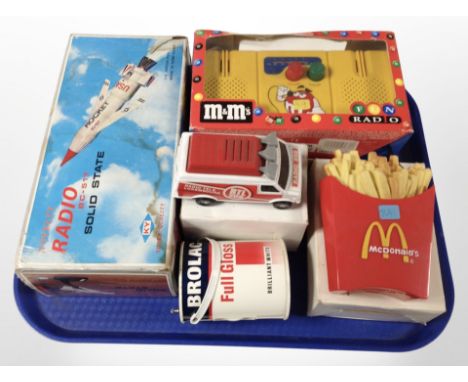 A group of novelty radios including model rocket, etc.