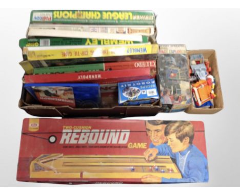 A box of vintage football-themed board games, other games, battery-operated Super Space Explorer Robot box (no contents) etc.
