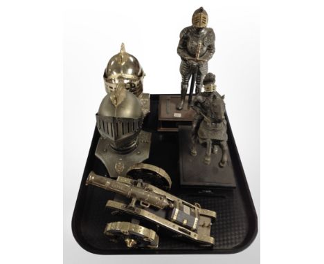 A decorative model cannon on carriage, together with two figures of knights and two similar busts.