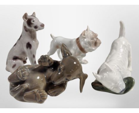 Four Bing and Grøndahl/Royal Copenhagen dogs, tallest 11cm.