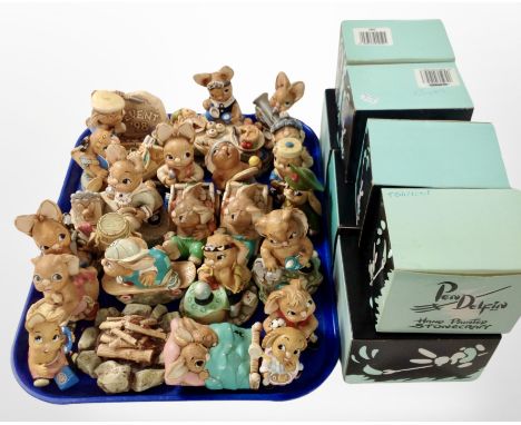 A collection of Pendelfin rabbit ornaments and seven boxes.