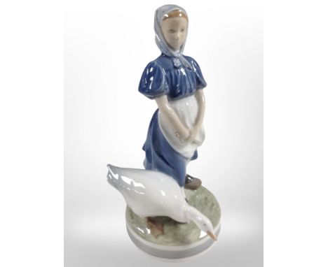 A Royal Copenhagen figure of a girl and a goose, height 24cm.