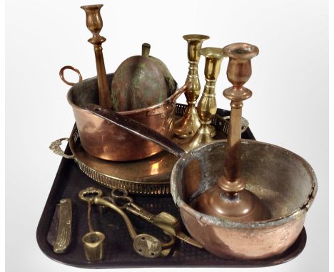 Antique metal wares to include two pairs of brass and copper candlesticks, a brass gallery tray, a copper twin-handled cookin