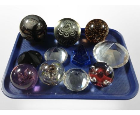 A group of glass paperweights including Caithness.