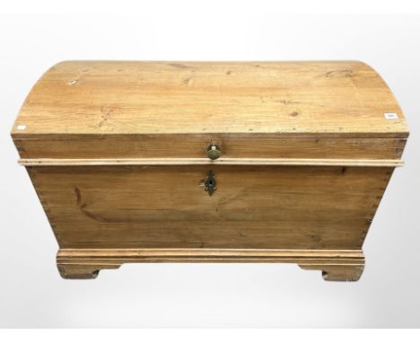 A 19th century pine dome topped trunk with cast iron handles, 128 cm long x 55 cm wide x 83 cm high 