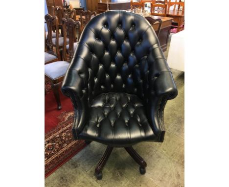 A deep Chesterfield button back office armchair