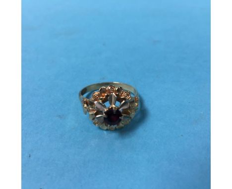 An 18ct gold ruby set ring, size 'P'