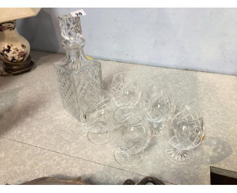 A cut glass whiskey decanter and five glasses