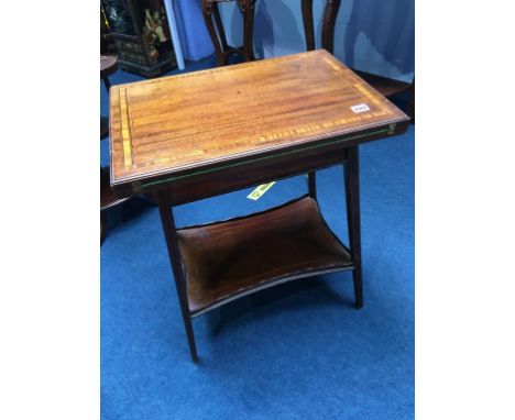 An Edwardian mahogany fold over card table